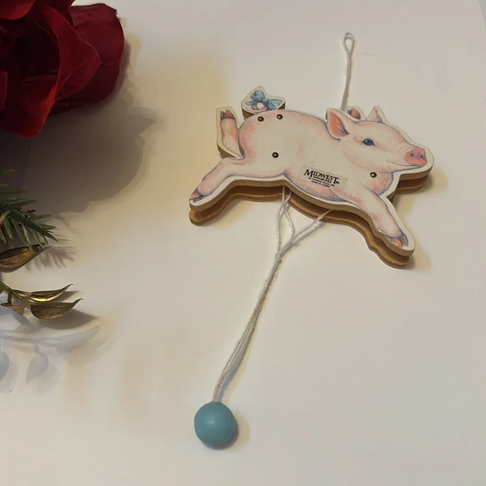 Flying Pig ornament Midwest Importers Canon Falls Wooden Pull String Toy
